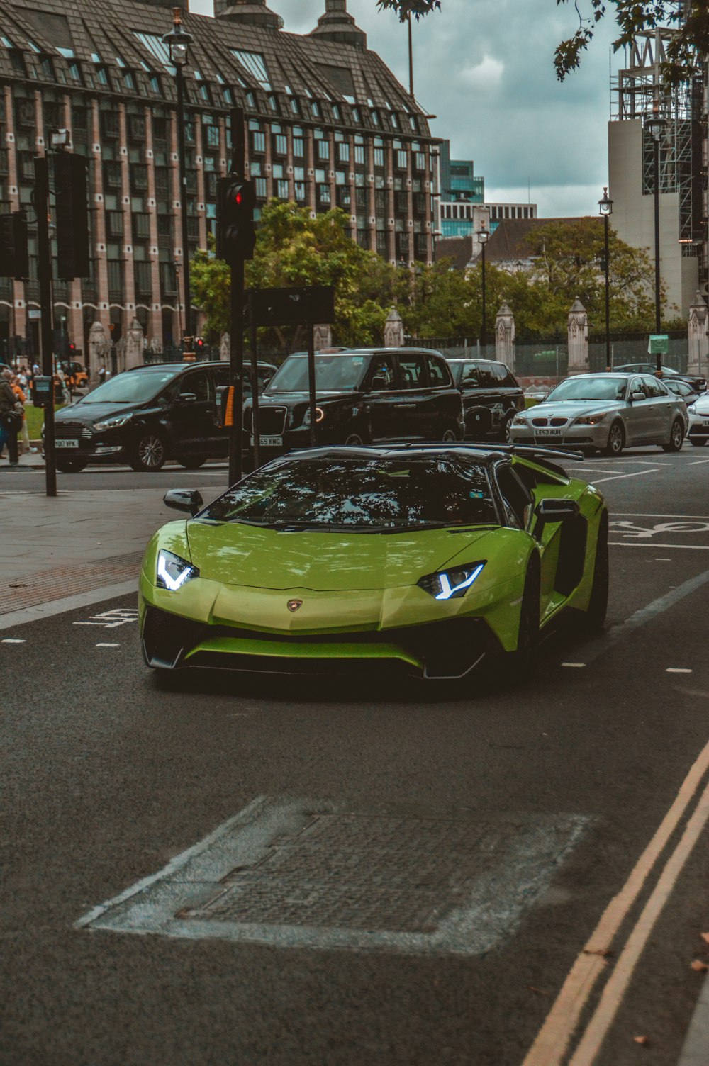 green porsche 911 on road during daytime