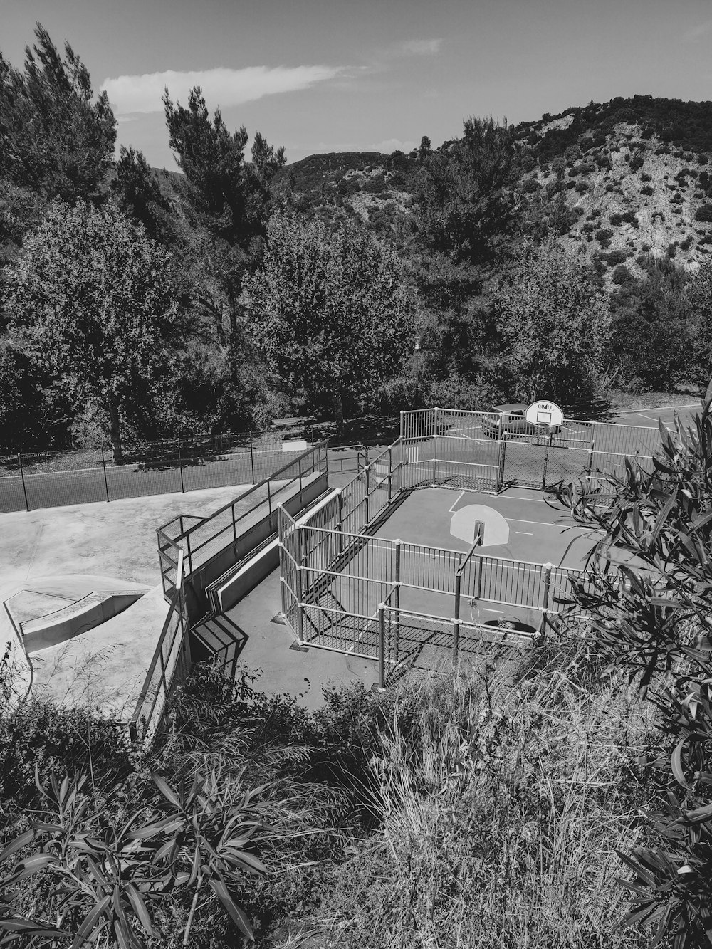 a black and white photo of a skate park
