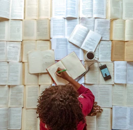 girl in pink shirt reading book
