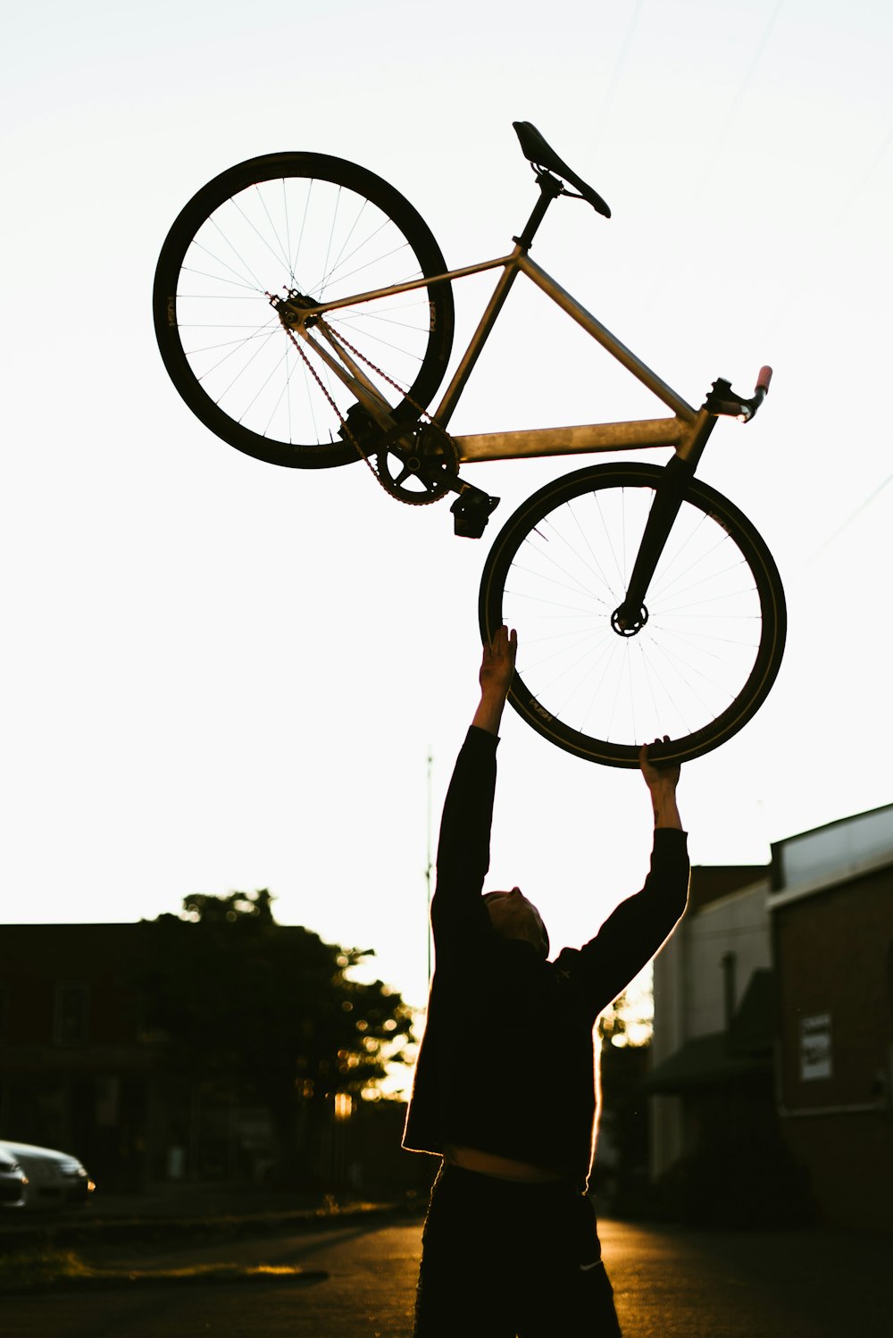 silhouette of person riding on bicycle