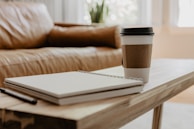 A cozy living room with a coffee setup and soft lighting.