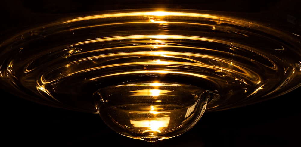 clear glass candle holder with yellow light