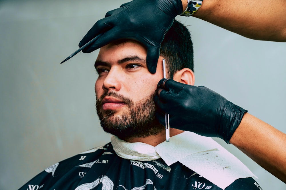 man in black leather gloves