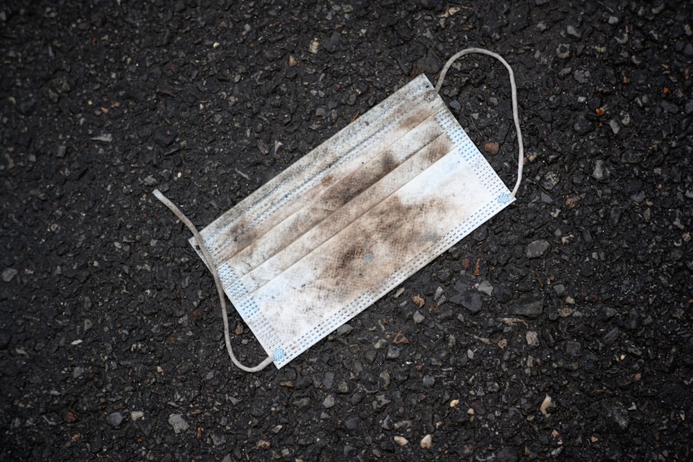 white and brown plastic pack on black and gray marble surface