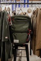 black and red backpack on black metal chair