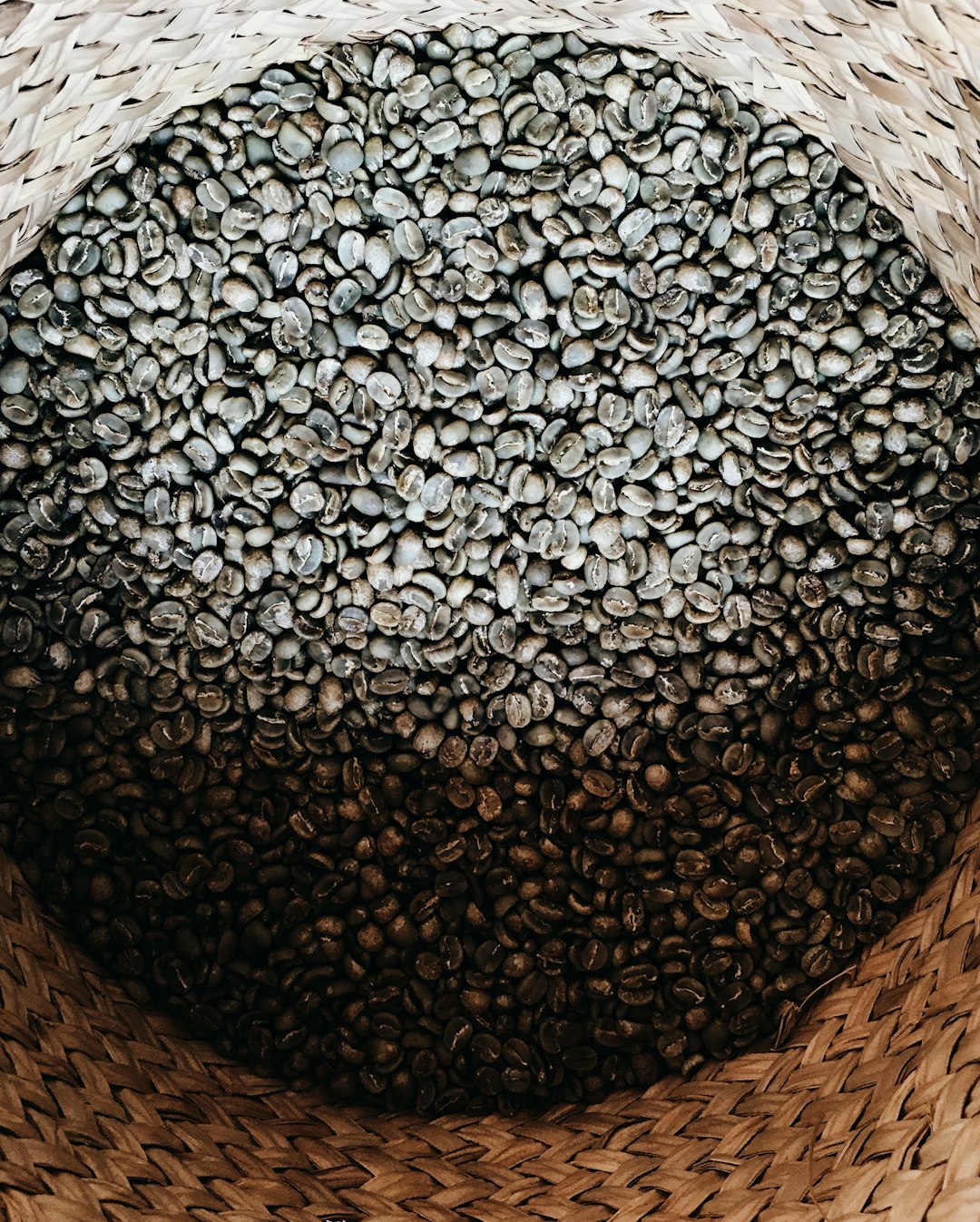 black and white textile on brown woven basket