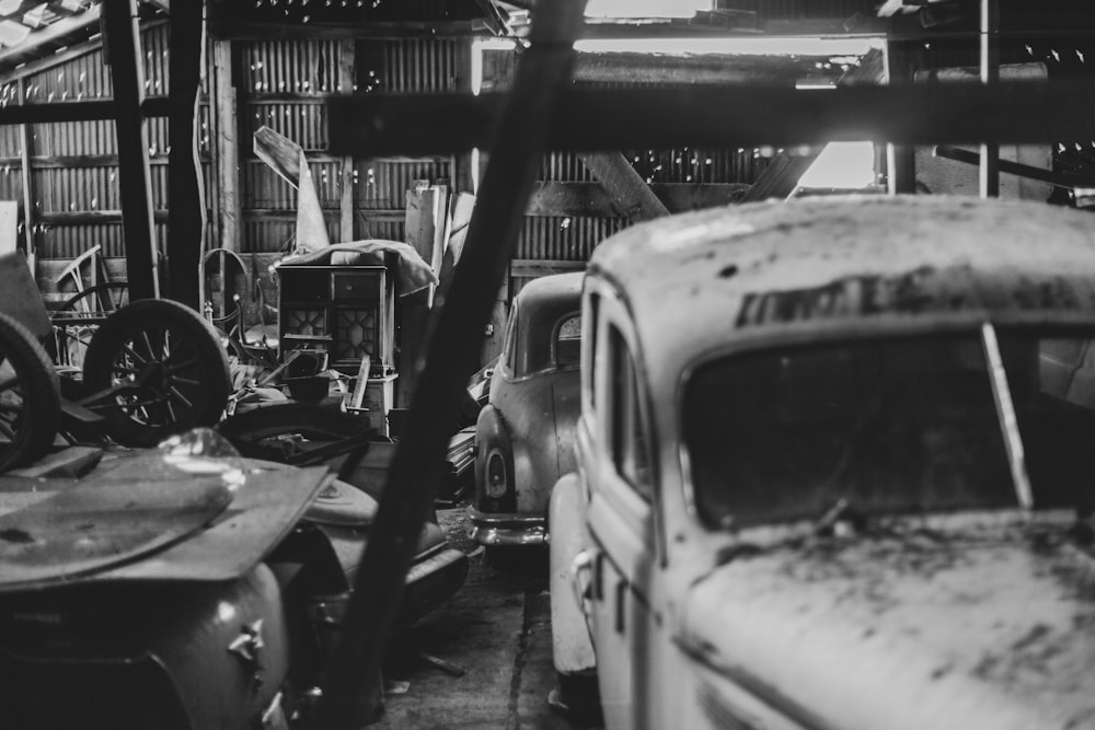 grayscale photo of car in a garage