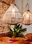 Modern pendant lights casting a warm glow over a dining table