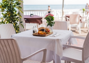 white ceramic plate on white table