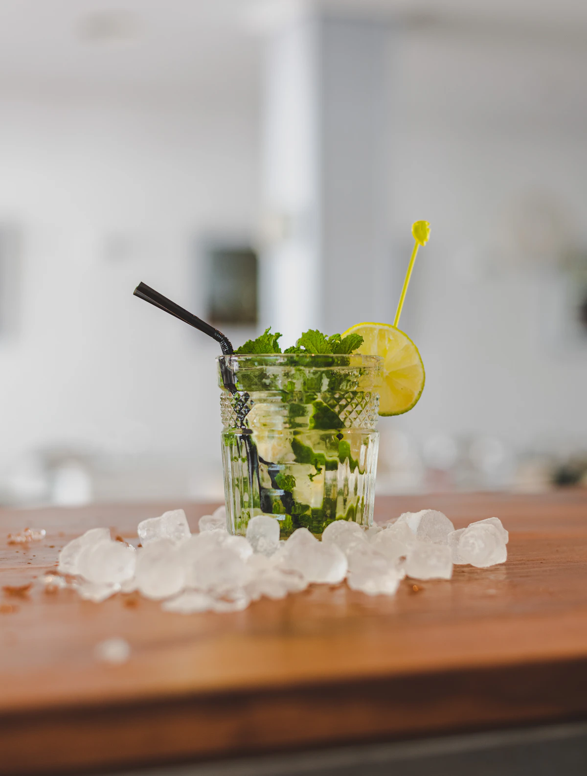 Mojito cocktail with mint and lime over crushed ice