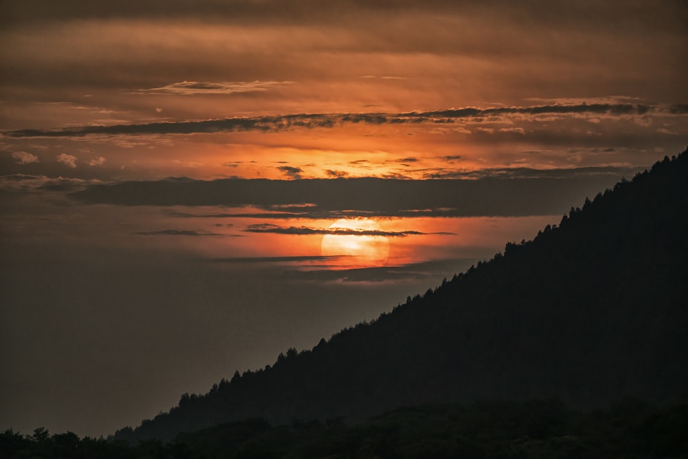 silhouette of mountain during sunset