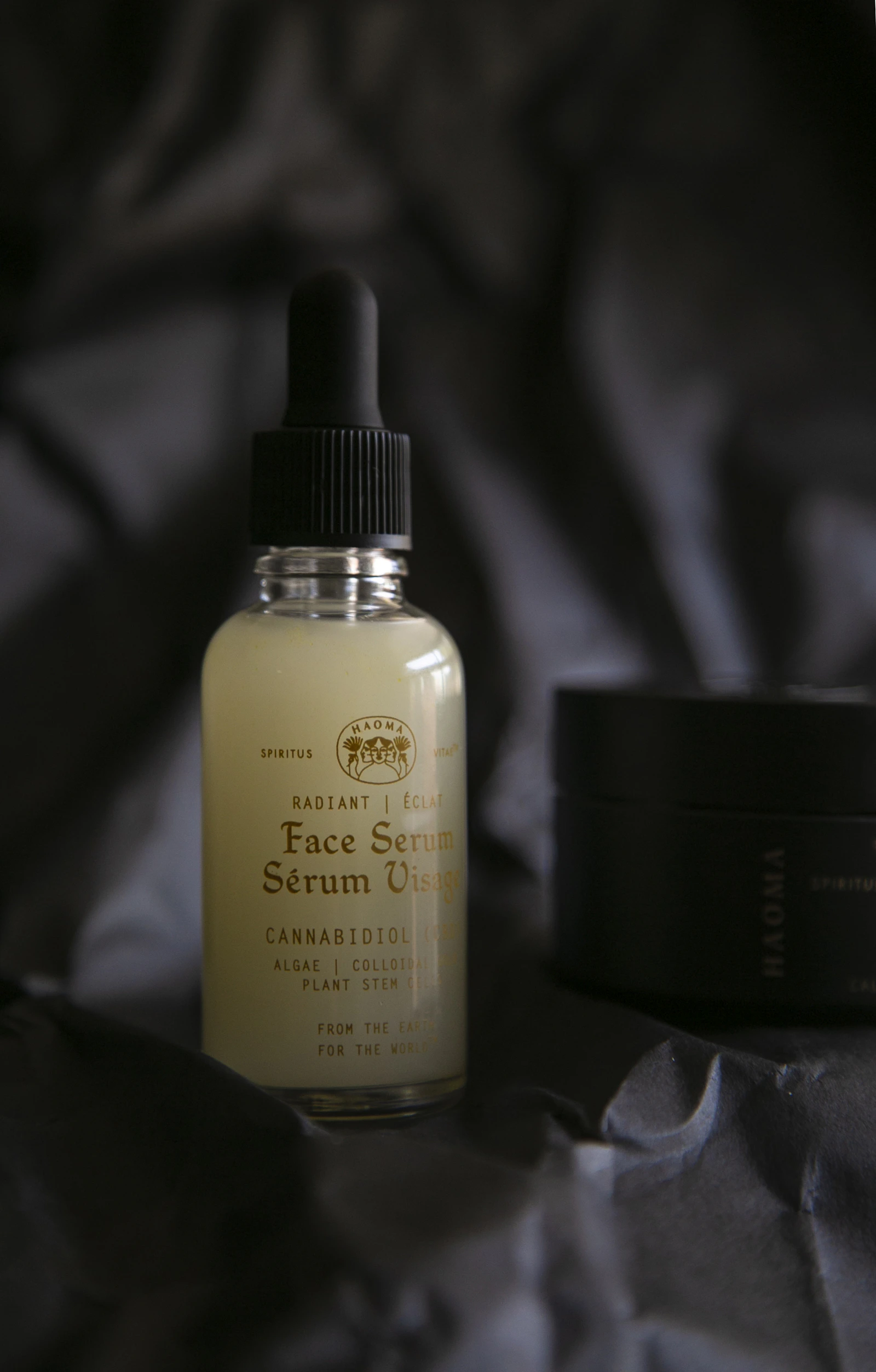Moisturiser being applied to hand in soft window light
