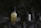 Two skincare products are positioned on a dark, textured background. The bottle on the left is a face serum with a dropper lid, featuring a label that includes the words 'Face Serum' and 'CBD'. On the right, a small jar labeled 'Day Cream' accompanies it, providing a sense of a skincare routine.