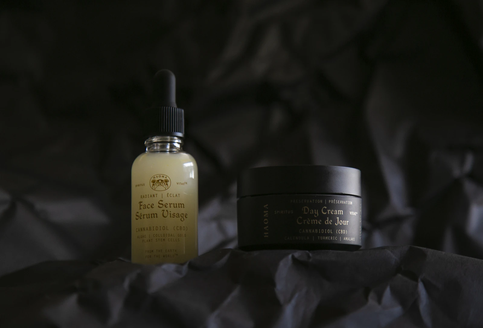 Face serum and day cream bottles from a natural skincare brand