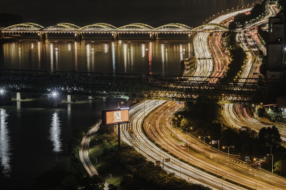 time lapse photography of cars on road during night time