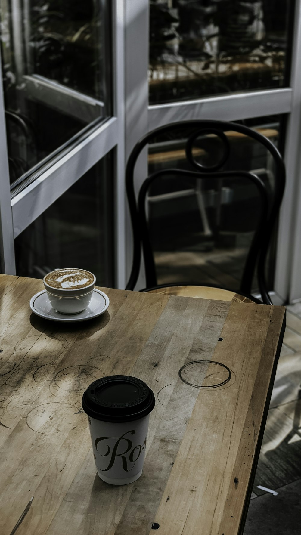 cappuccino on brown wooden table