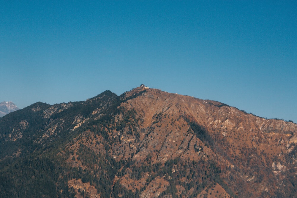 brown and green mountain under blue sky during daytime