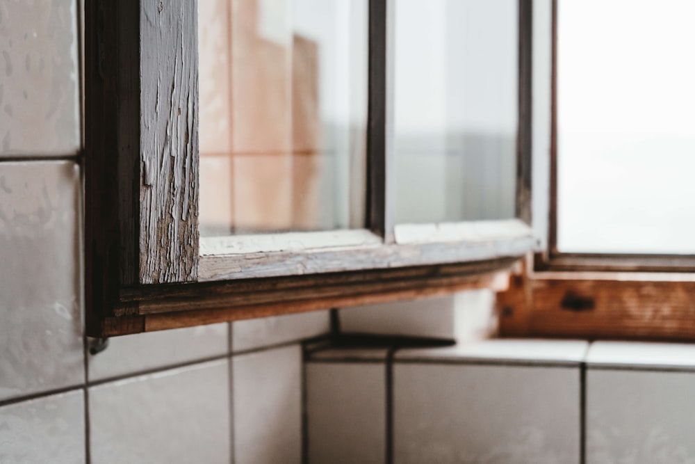 brown wooden framed glass window