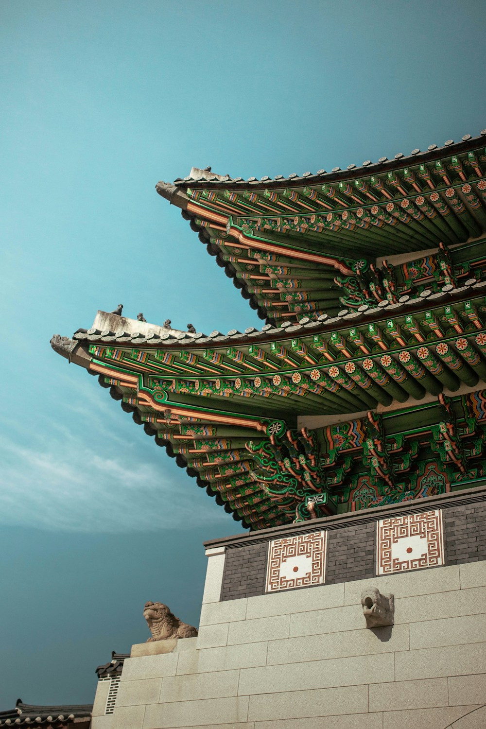 Autumn leaves beside a Korean palace