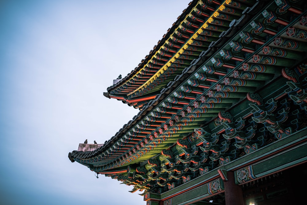 brown and green temple under white sky during daytime