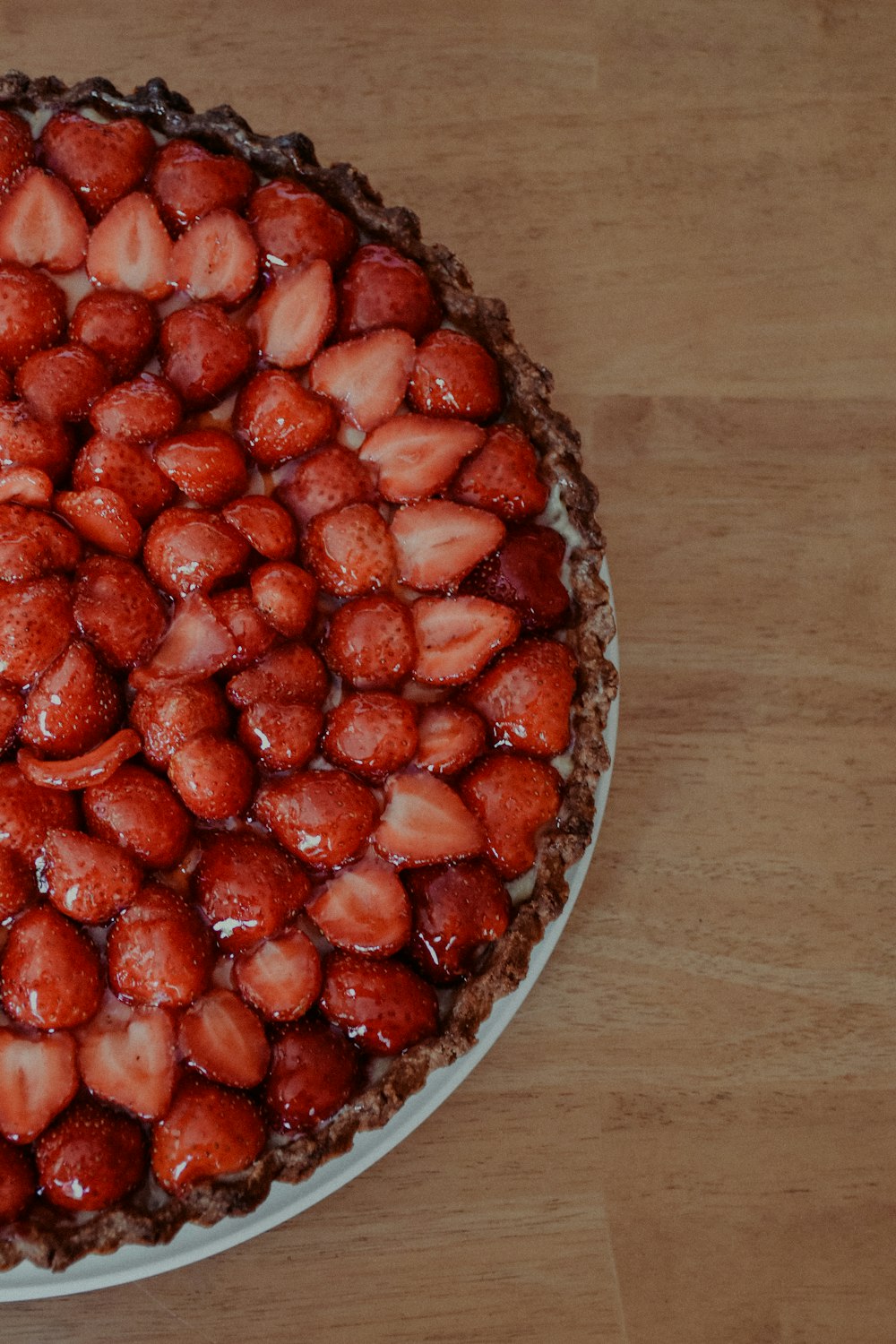 strawberries on clear glass bowl