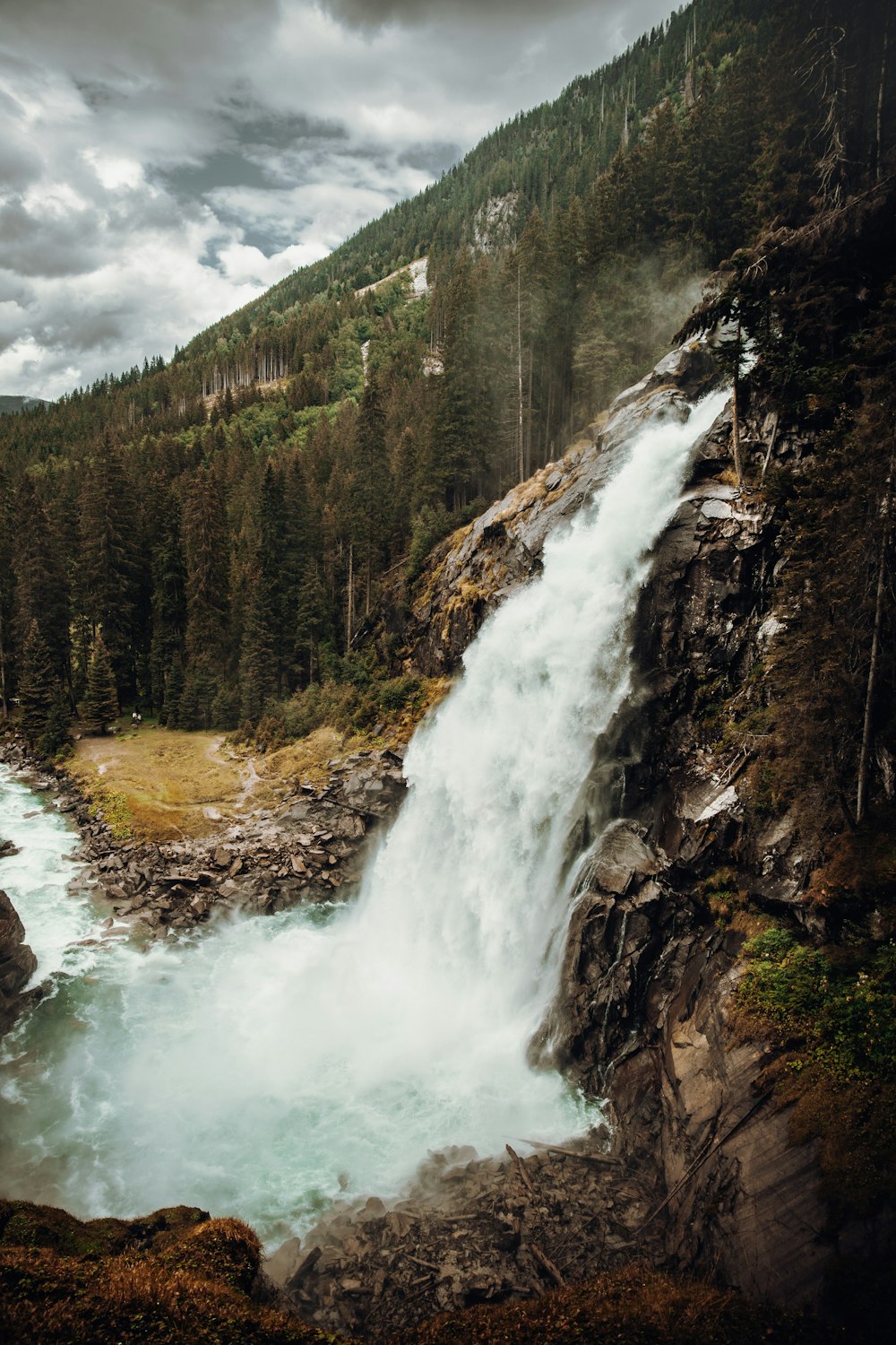 waterfalls in the middle of the forest