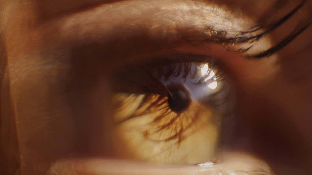 persons eye in close up photography