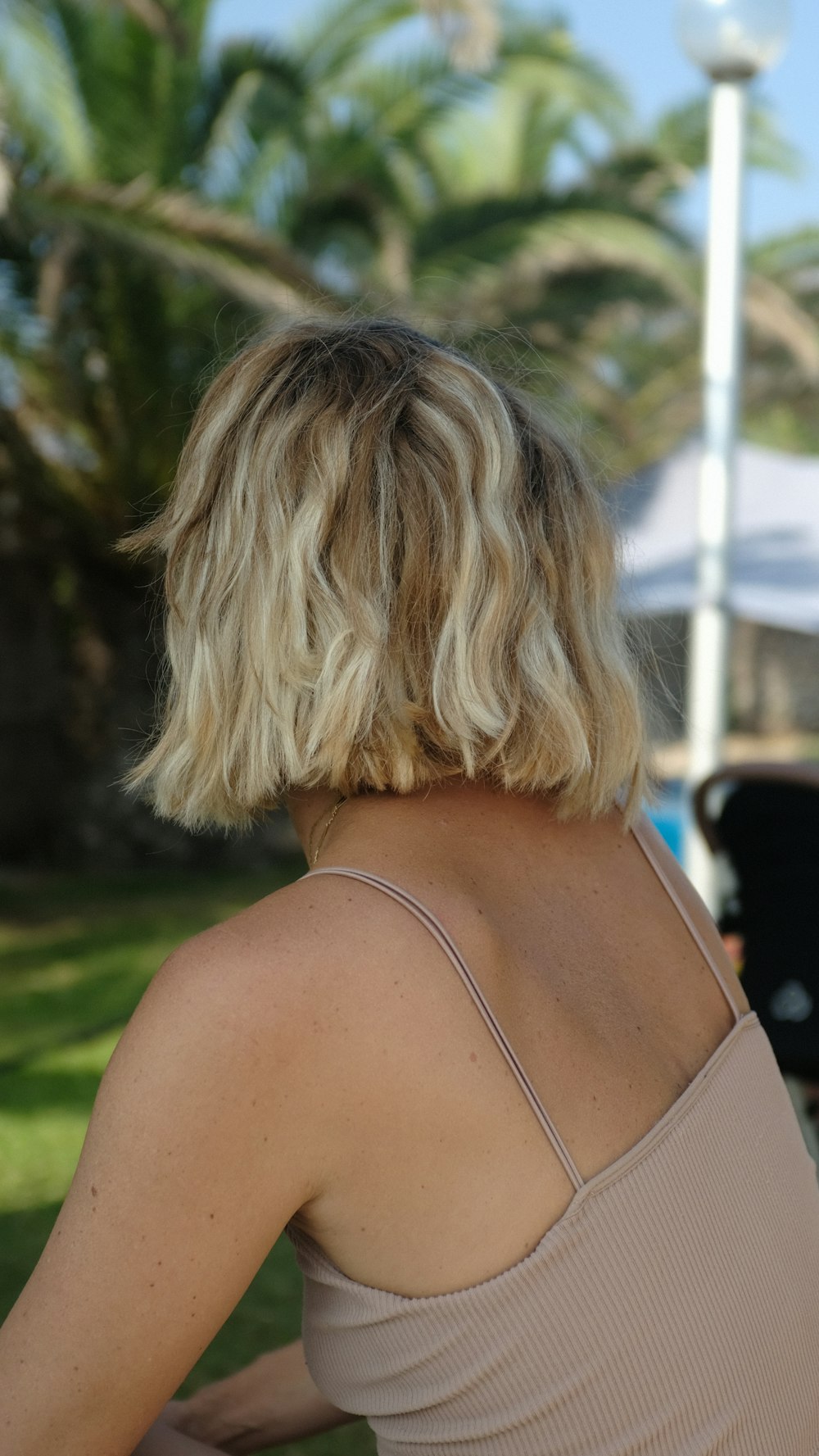 woman in brown spaghetti strap top