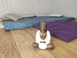 A peaceful meditation session in a sunlit room with wooden floors.