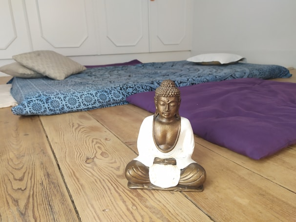 A serene meditation space with soft lighting and cushions.