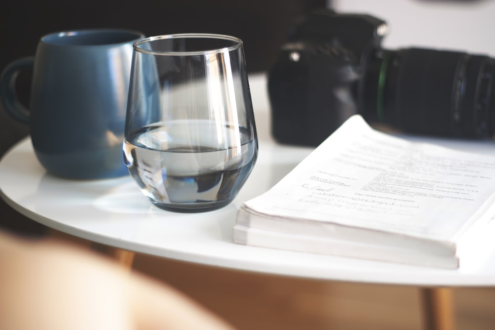 blue glass cup on white table