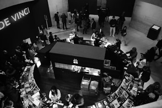 people in a restaurant in a grayscale photography