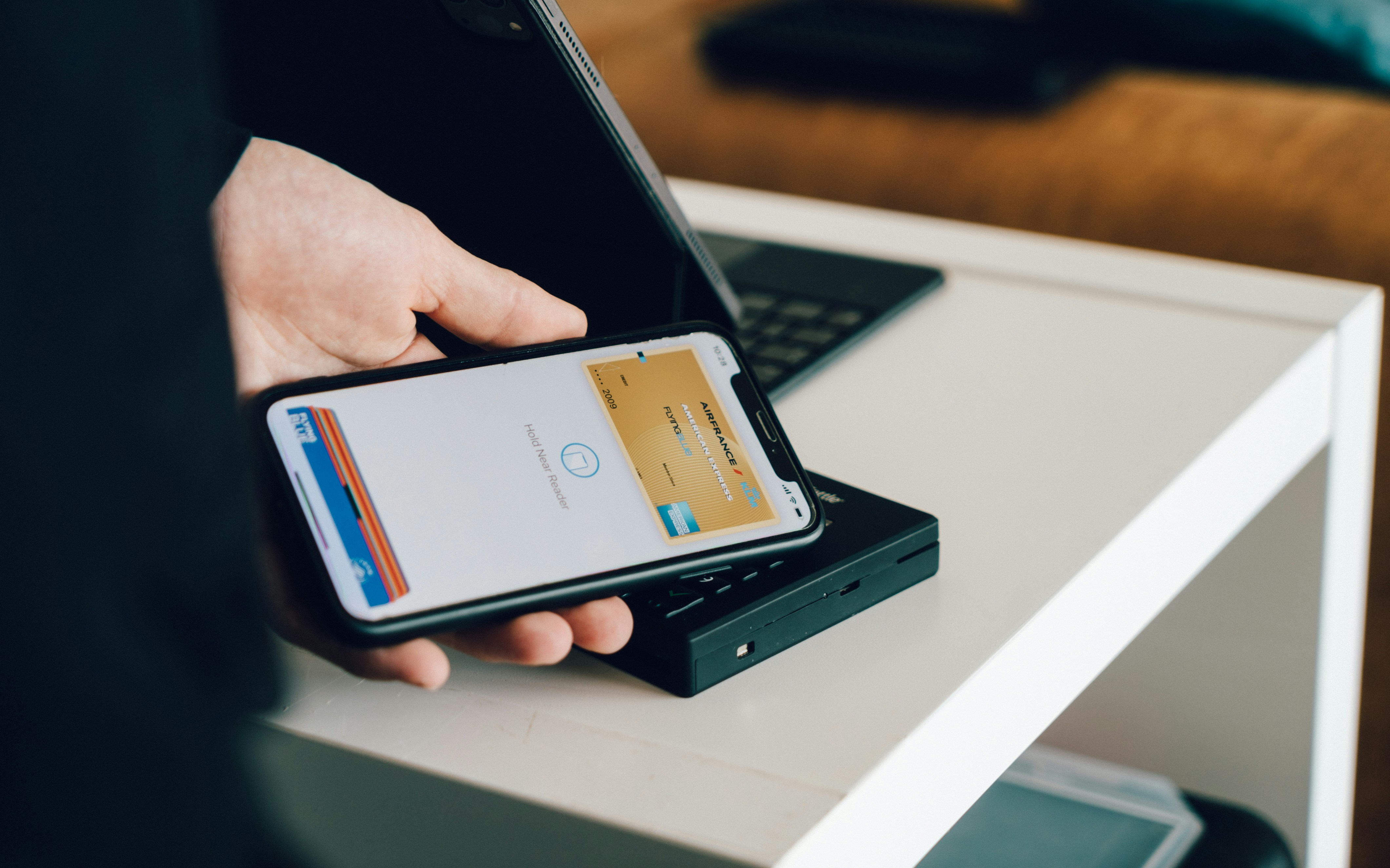 Apple iPhone showing Apple Wallet credit card transaction interface