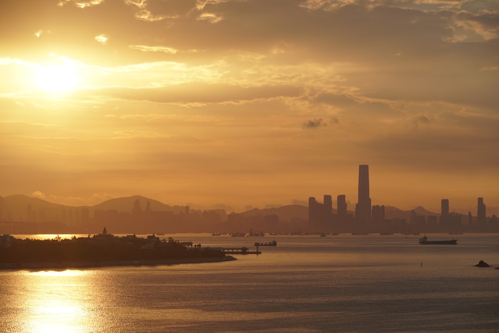 silhouette of city buildings during sunset