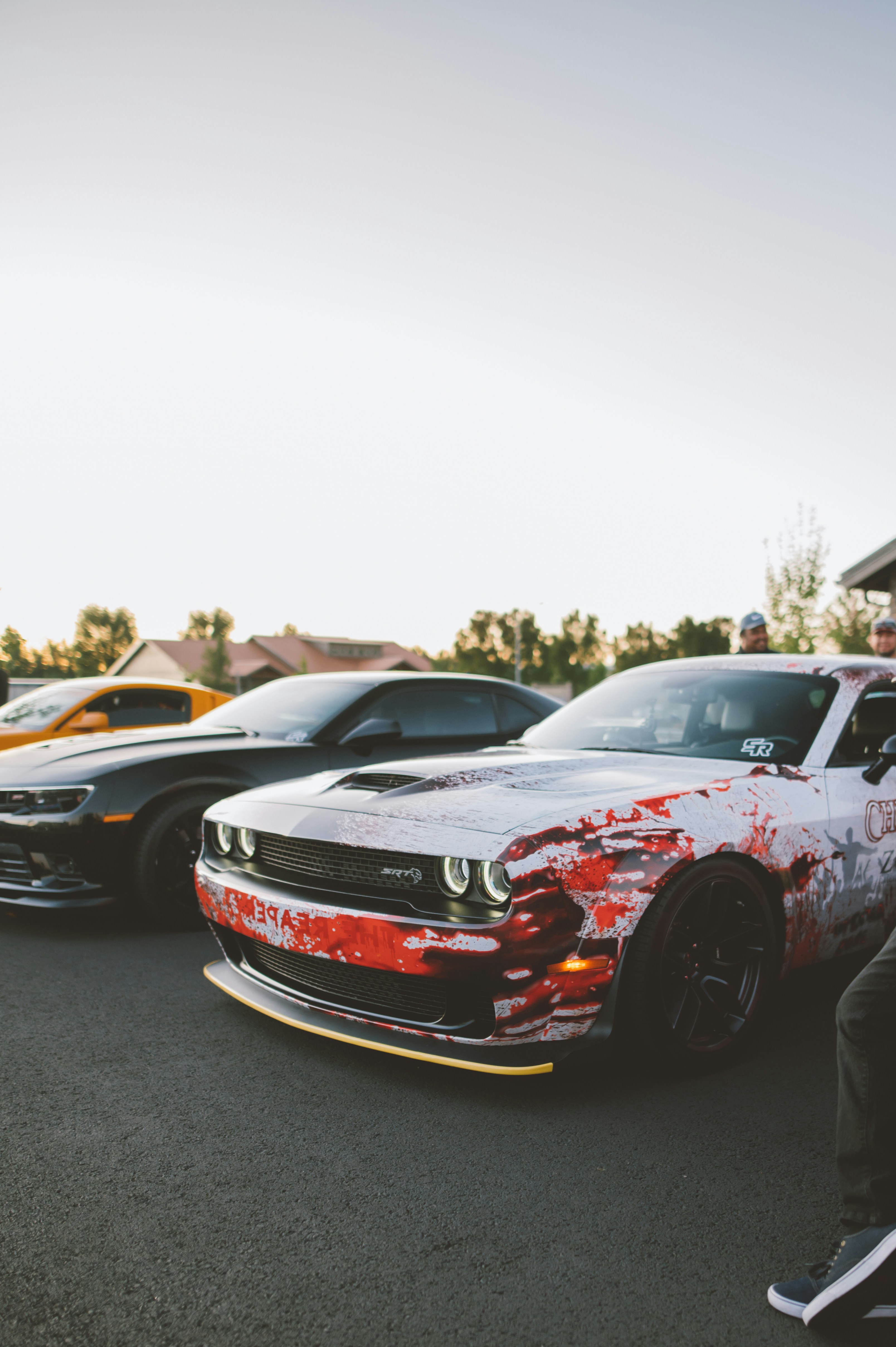 red and black chevrolet camaro