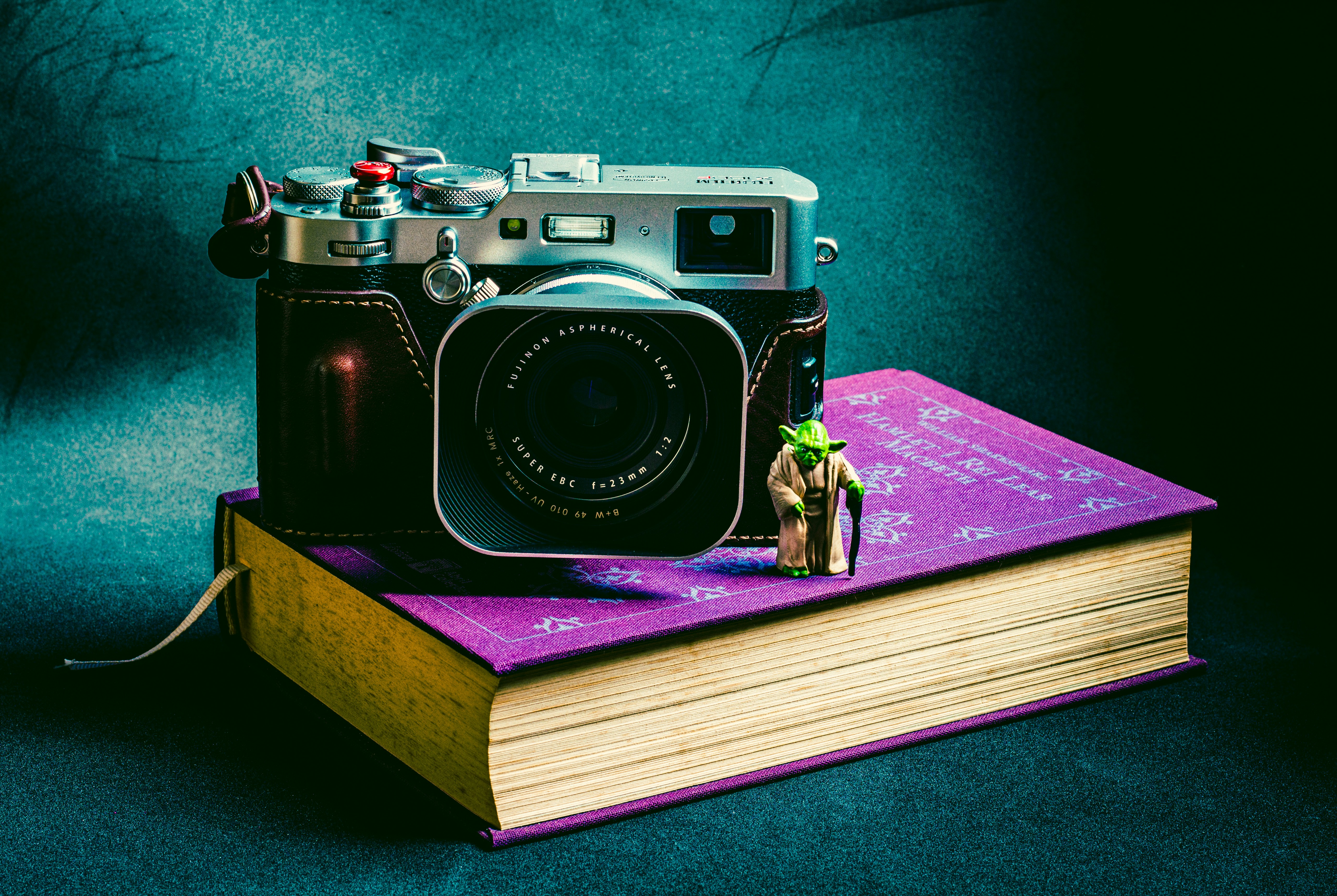 black and silver camera on brown wooden table