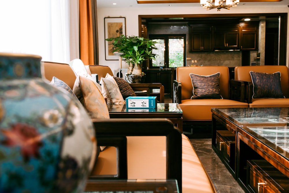 brown wooden coffee table near brown sofa