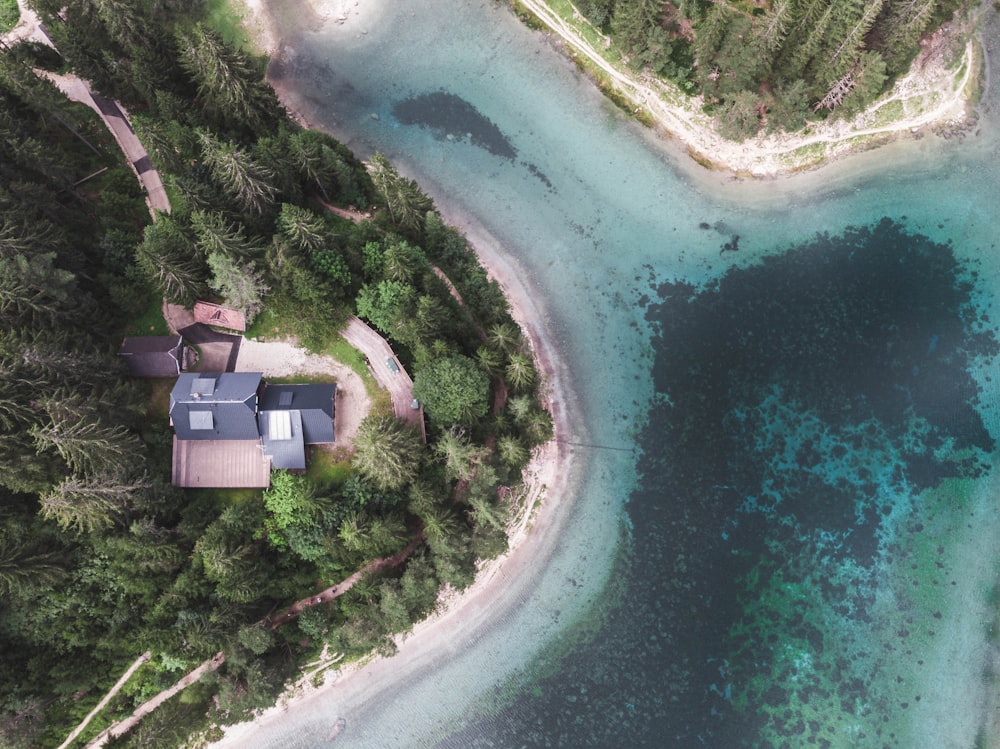 Aerial view of house near body of water during daytime photo – Free ...