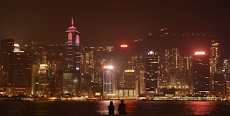 A vibrant city skyline with tourists enjoying a guided tour in the foreground.