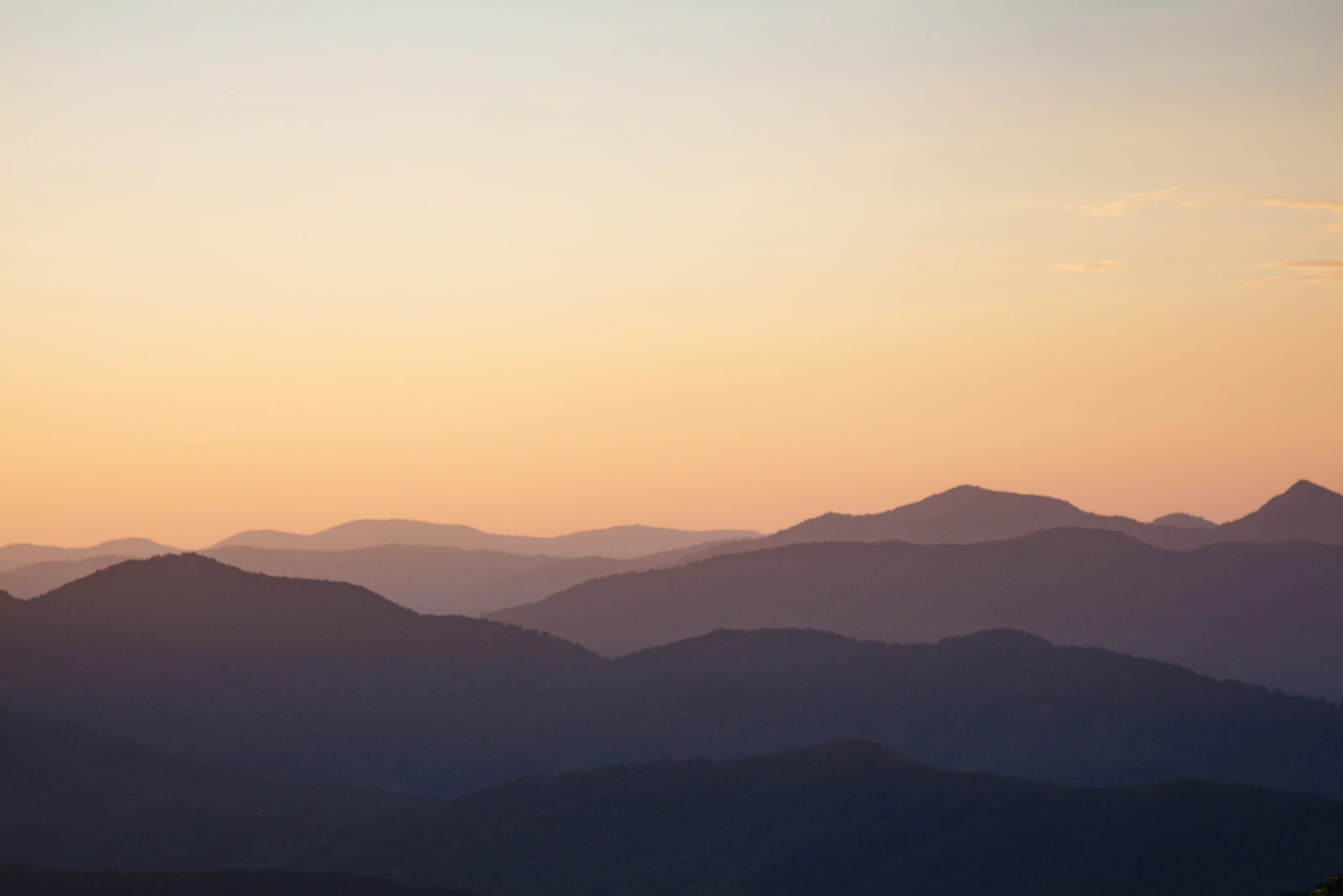 The Blue Ridge Mountains at sunset — the view that surrounds Asheville, North Carolina