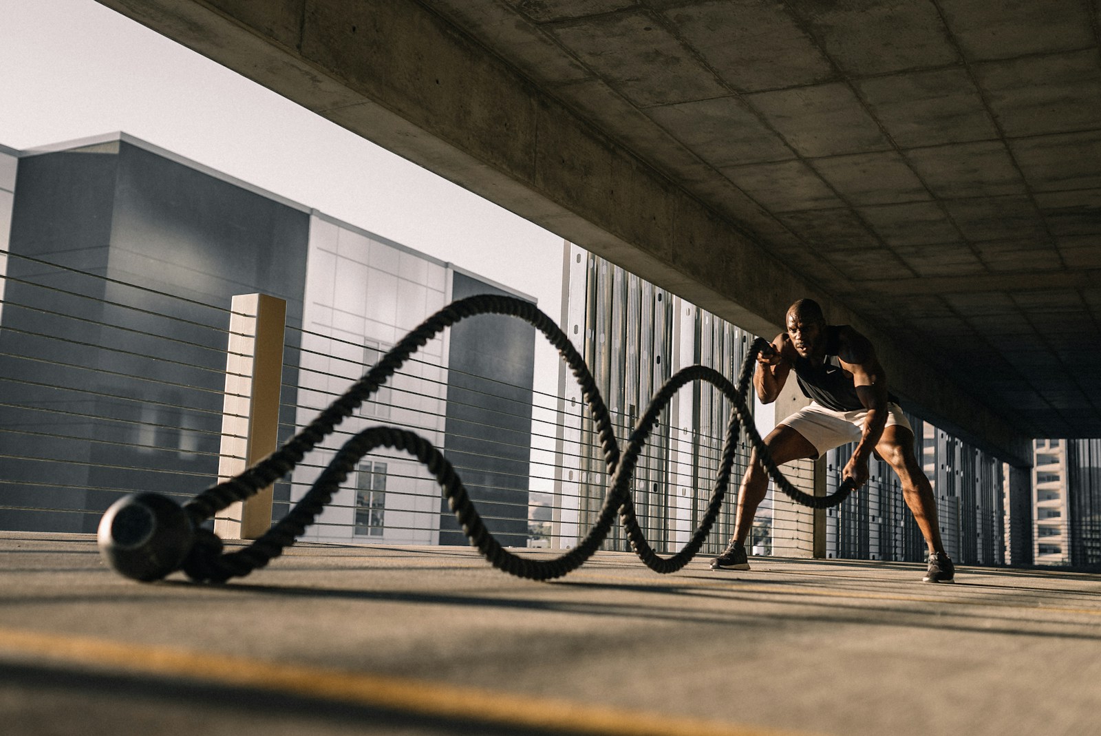 Heavy training ropes running down a wide concrete conditioning area