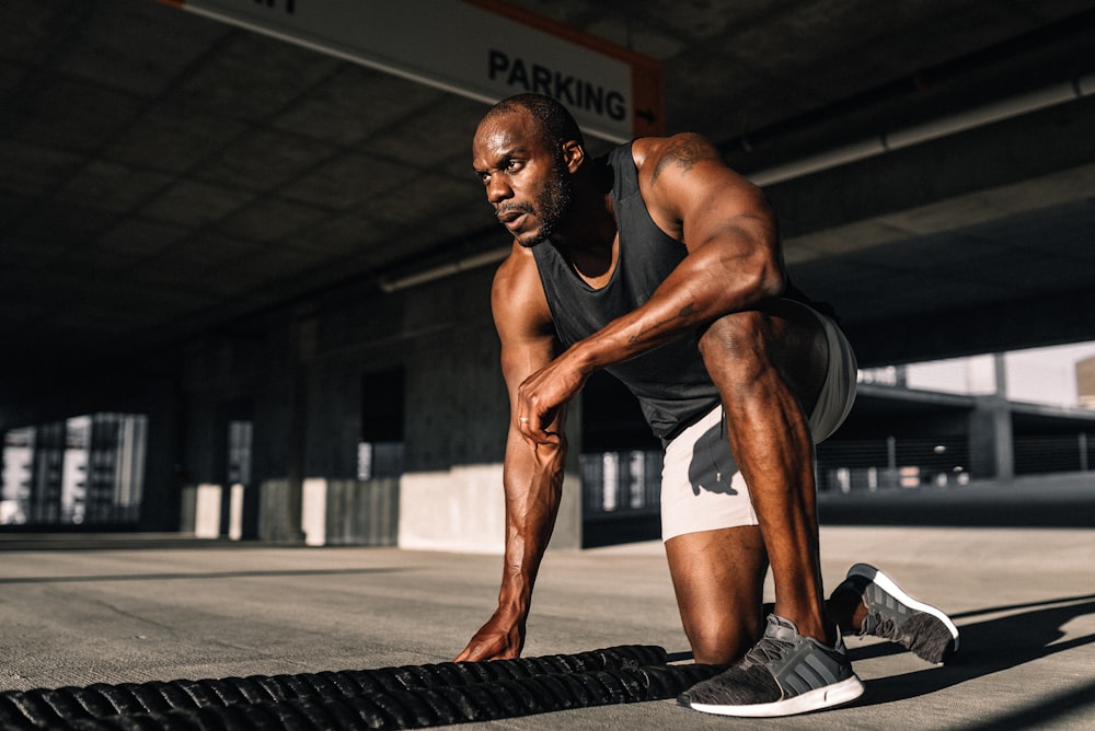 man in black and white shorts doing exercise