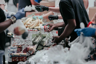 volunteers sorting canned food donations