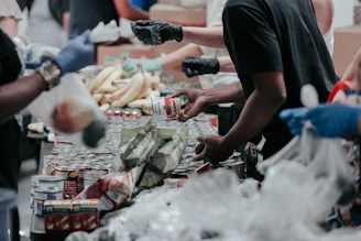 volunteers sorting canned food donations