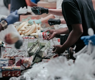 man in black t-shirt holding coca cola bottle