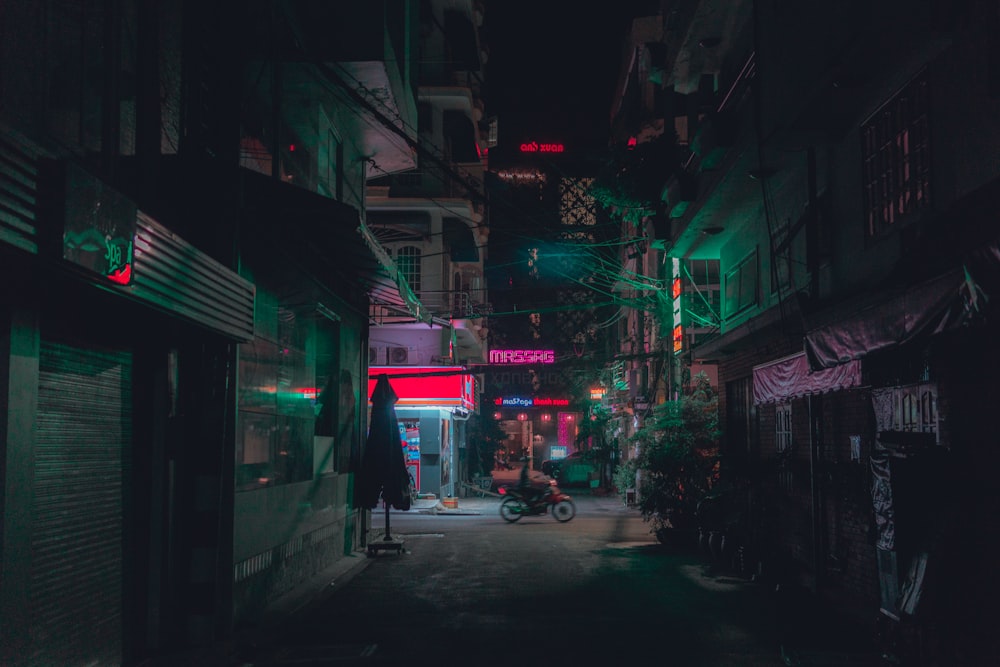 people walking on street during night time