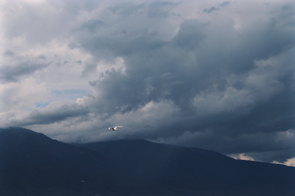 black mountain under white clouds during daytime