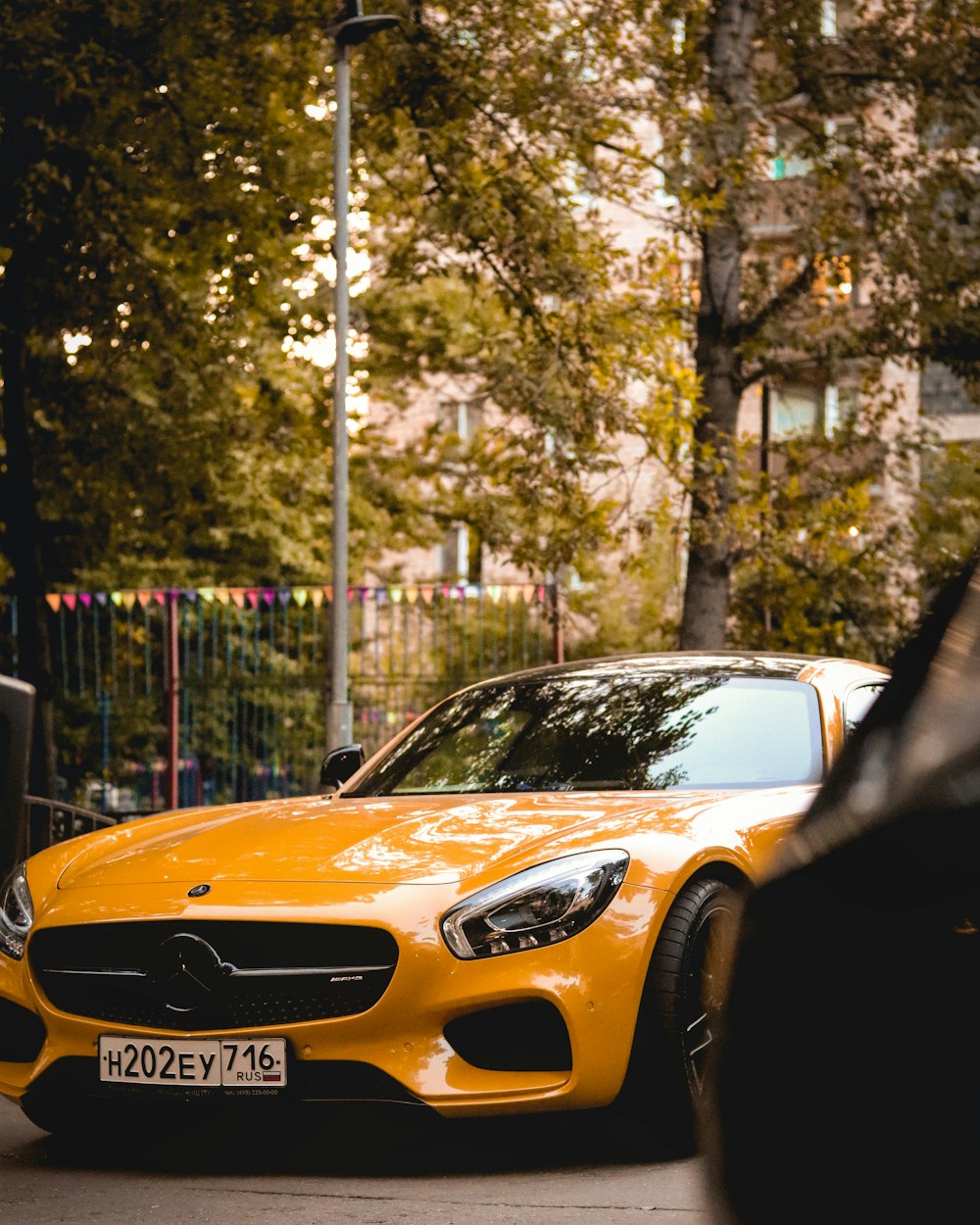 yellow porsche 911 parked near trees during daytime photo – Free Russia  Image on Unsplash