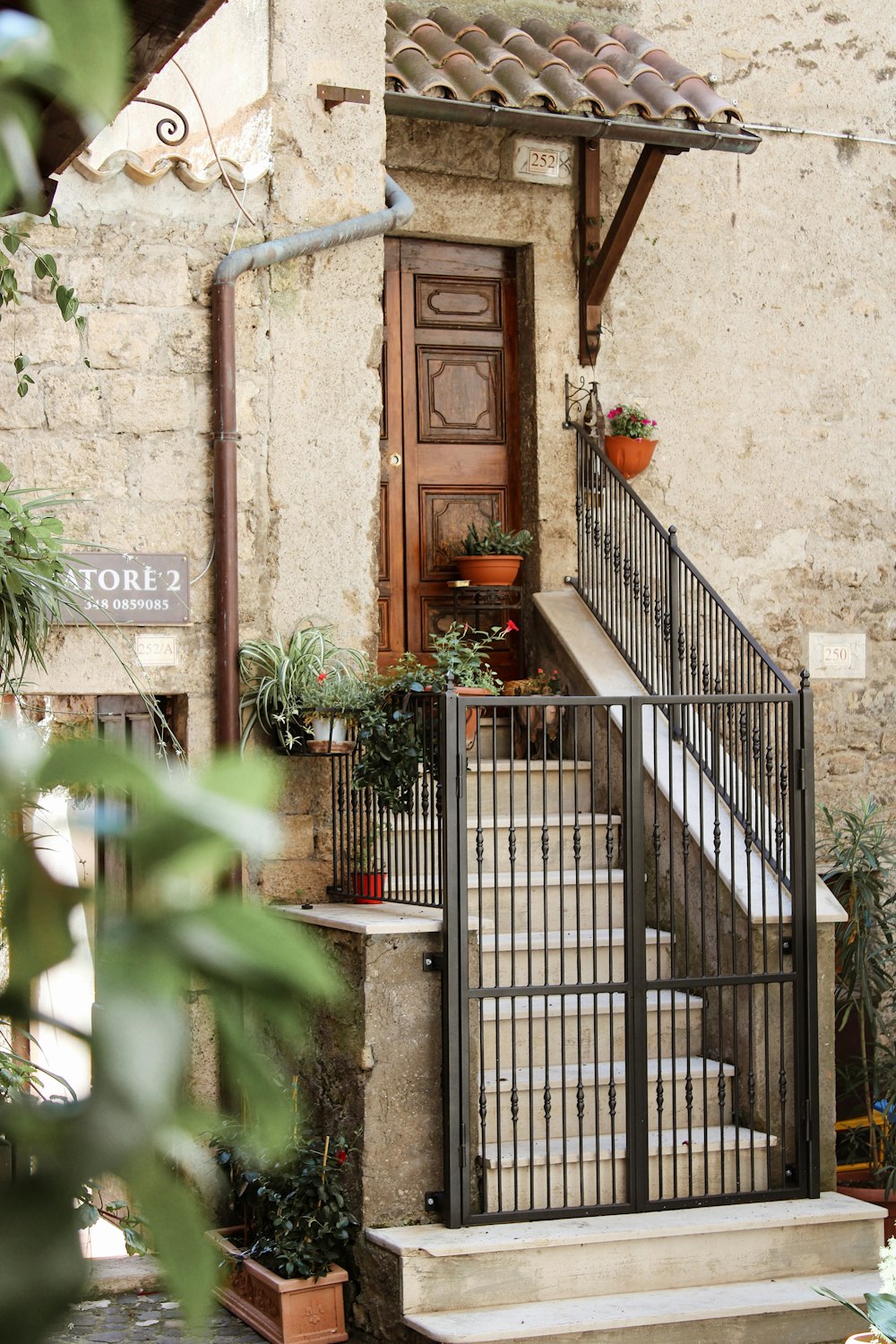 brown wooden door on brown concrete building