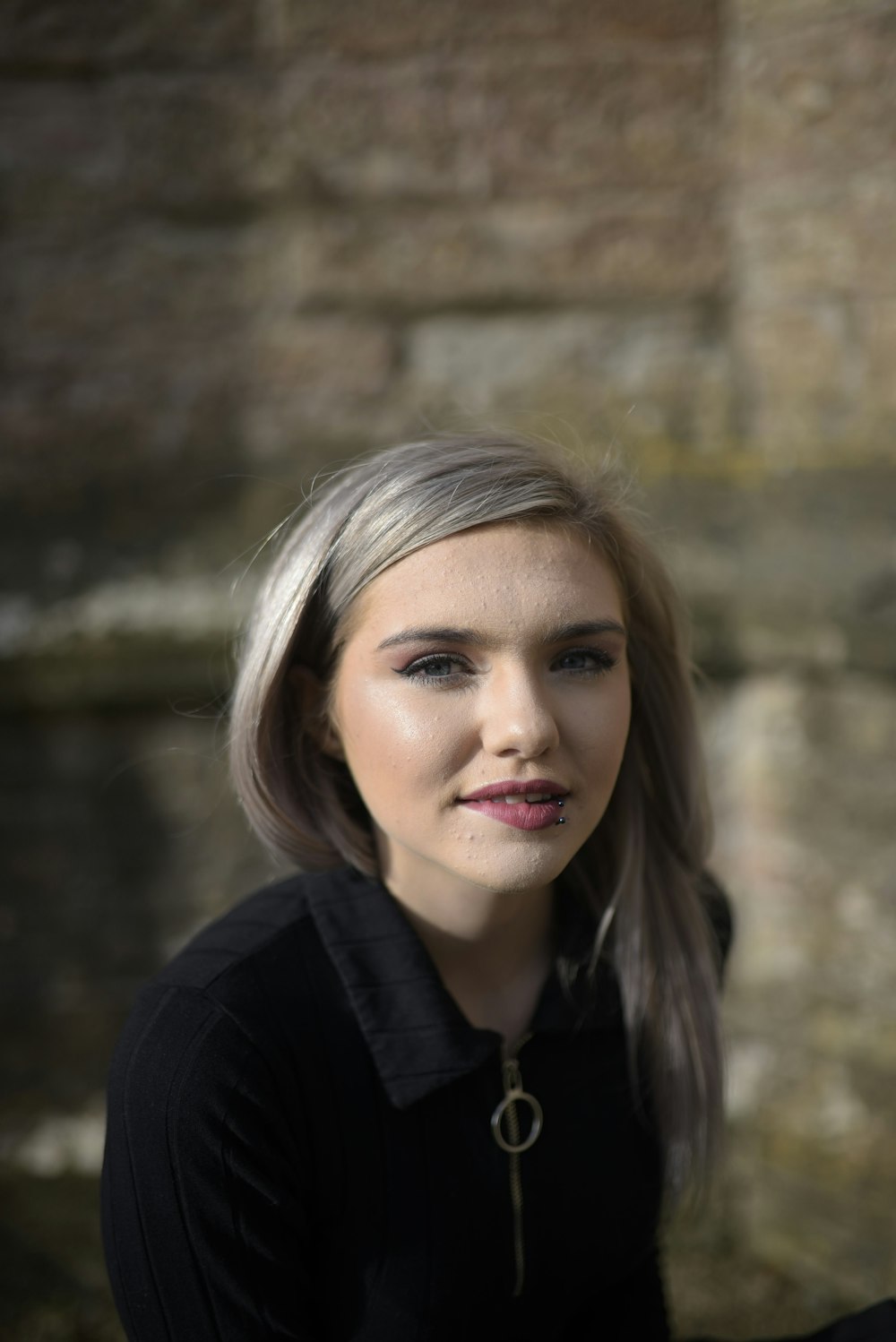 woman in black shirt smiling